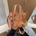 Pink marbled shoulder bucket bag with adjustable strap and cute monster plush charm - Pink with Pendant