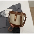 Detail of retro bucket bag with brown leather trim and golden metal twist lock closure - White and Coffee without Pendant