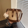 Brown and beige canvas bucket bag with gold clasp and plush charm detail - White Brown With Pendant