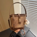 Brown canvas and leather bucket bag with plush charm and adjustable shoulder strap - Coffee with Pendant