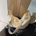 Minimalist creamy white shoulder bag with soft leather texture and wide adjustable strap - Off White