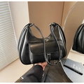 Detail shot of black faux leather hobo bag with front buckle pocket and zipper closure - Black