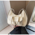 Close-up of off-white faux leather underarm bag with silver buckle and front pocket - Off White