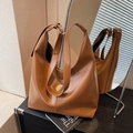 Caramel brown leather hobo bag with iconic triangle metal plaque and gold buckle strap - Khaki