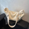 Chic beige crossbody hobo bag with wide shoulder strap and soft faux leather finish - Off White