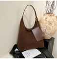 Brown plush tote bag with leather strap and mini pouch in minimalist indoor setting - Brown