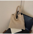 Detailed close-up of khaki knit tote bag with horizontal woven texture on a chair - Khaki