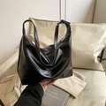 Large black hobo shoulder bag in glossy synthetic leather with a minimalist brand tag - Black