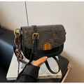 Detail of crossbody bag with black faux leather and grey crocodile pattern flap texture - With Charm / Black