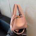 Pink lychee grain leather bucket bag with top handles and adjustable shoulder strap - Pink