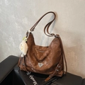 Brown faux leather vintage shoulder bag with metal triangle plaque and plush charm accessory - Coffee with Pendant