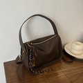 Deep brown leather barrel bag with broad handle and elegant gold-tone hardware accents - With Pendant / Brown
