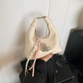Cream white glossy dumpling handbag with colorful woven ropes and abacus charm - Off White