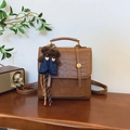 Dark brown retro backpack in crocodile embossed leather with a cute bear charm - Brown with Pendant