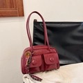 Deep red vintage shoulder bag with dual pockets and heart charm in polished finish - Red with Pendant