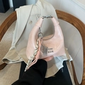 Light pink patent leather half-moon handbag with metallic handle and woven charm - Pink