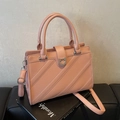 Coral pink faux leather tote bag with lychee texture and rhinestone buckle detail - Pink