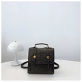 Dark green backpack with crocodile pattern flap and golden buckle on white desk - Black without Pendant