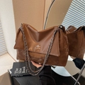 Dark brown patchwork leather shoulder bag with silver chain strap and brand logo - Brown