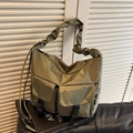 Army green nylon tote bag featuring cargo pockets and stylish ruched shoulder strap - Green