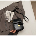 Black cross-body phone bag with oily leather texture and golden metal pendant detail - Black without Pendant
