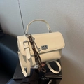 Creamy white leather square handbag with top handle and vintage charms - With Charm / Off White