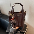 Dark brown patent leather bucket bag with top handles and cute bear charm pendant - Brown
