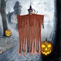 Detail of hanging Halloween skeleton ghost with tattered orange gauze and a wizard hat - Orange Clothes With Purple Ribbon Style
