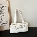 Sleek white leather underarm bag featuring decorative silver rings and thin shoulder straps - White