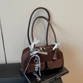 Chic dark brown faux leather shoulder bag featuring bow ribbons and heart charms - With Charm / Coffee