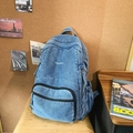 Vintage blue washed denim backpack with 7street embroidery and front zipper pocket - Light Blue