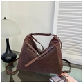 Detail of dark brown tote bag showing mixed textures of suede and smooth leather finishes - Brown