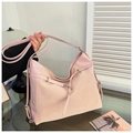 Detail of pink patchwork tote bag with silver metal buckles and textured leather finish - Pink