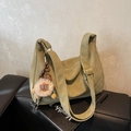 Retro olive green oversized hobo bag in matte leather with wide strap and plush charm - Green