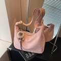Pink suede dumpling bag with gold hardware and a cute lion plush pendant charm - Pink