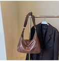 Detail of dark brown hobo bag with glossy finish hung on a blazer for outfit styling - Coffee (No Pendant)