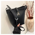 Detail of lychee pattern leather bucket bag with silver metal twist lock closure - Black