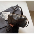 Detail of vintage oil wax leather boston bag with embossed SOL TIVA TOR lettering - No Pendant / Coffee