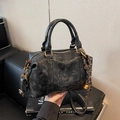 Black distressed leather pillow bag with woven rope detail and metal charm - With Charm / Black