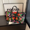 Large travel bag with black floral and phoenix print, dual handles and shoulder strap - Black