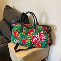 Green floral travel bag with traditional pattern and black faux leather handles - Green