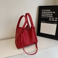 Red lychee grain leather bucket bag with top handles and adjustable shoulder strap - Burgundy