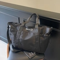 Bolso tote negro de gran capacidad con logo NOCO y correa ajustable para viajes - Negro