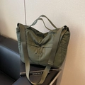 Olive green nylon tote bag with dual front zipper pockets and adjustable wide strap - Green