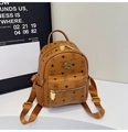 Close-up of brown PU backpack featuring teddy bear pattern and golden bear-shaped zipper - No Pendant / Brown