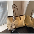Detail of ginger suede tote bag featuring quilted patterns and a decorative hanging strap - Light Khaki