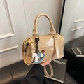 Chic beige faux leather Boston bag with embossed lettering and wooden horse charm - Khaki with Pendant