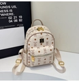 Mini backpack in cream and brown with bear pattern and gold metal pendant detail - No Pendant / Off White