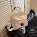 Mini borsa a tracolla in nylon bianco crema con manici in pelle marrone e tracolla - Bianco Sporco
