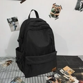 Classic black minimalist backpack with multiple compartments and reinforced top handle - Black
